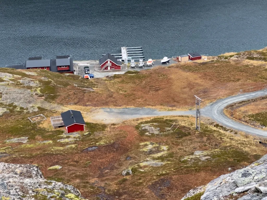 The Myrfjord waterfront buildings seen from a hillside above the fjord.