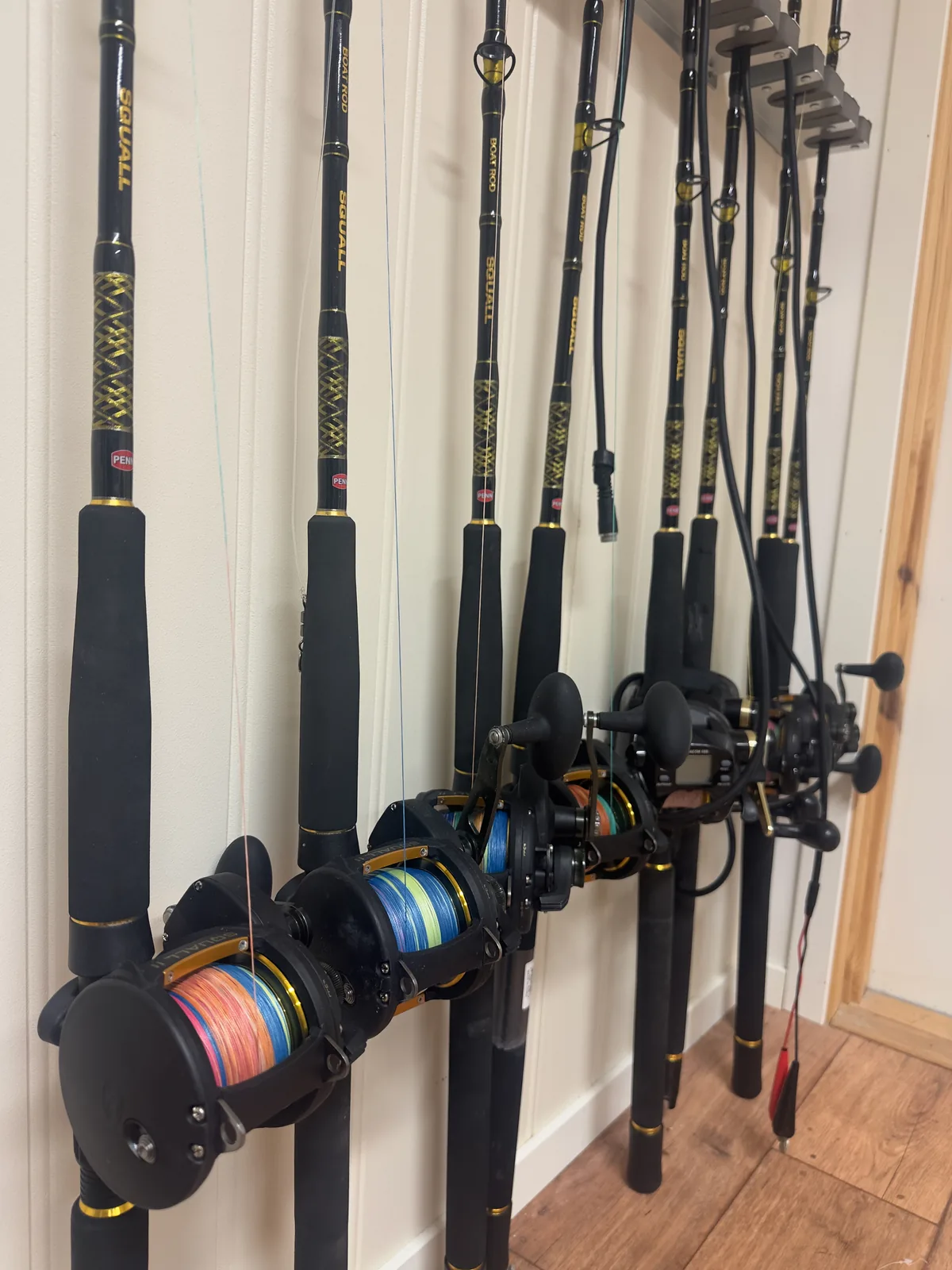 Sea fishing rods and reels displayed at Myrfjord Sjøhus
